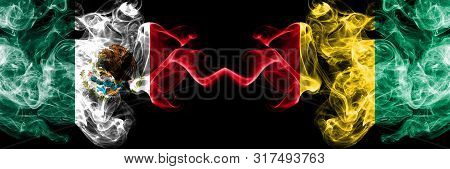 Mexico Vs Guinea, Guinean Smoky Mystic Flags Placed Side By Side. Thick Colored Silky Abstract Smoke