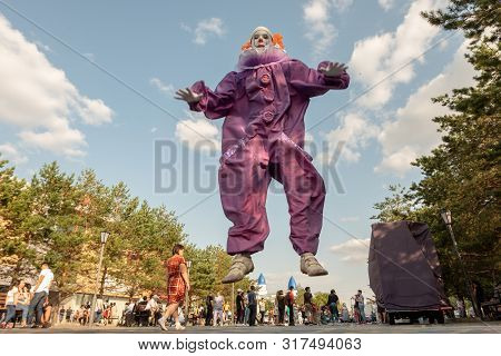 19-08-16, Kostanay, Kazakhstan. A Guy In A It Suit Bounced Above The Ground. Cosplay For Carnival Or
