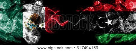 Mexico Vs Libya, Libyan Smoky Mystic Flags Placed Side By Side. Thick Colored Silky Abstract Smokes 