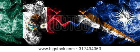 Mexico Vs Marshall Islands Smoky Mystic Flags Placed Side By Side. Thick Colored Silky Abstract Smok