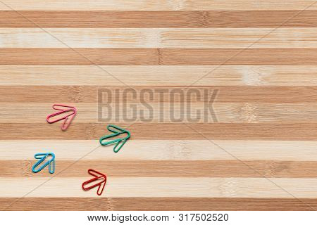 Many Arrows Pointing Upwards On White Background, Shot From Above.