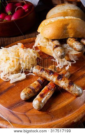 Rustic Nürnberger Bratwurst With Sauerkraut And Roll