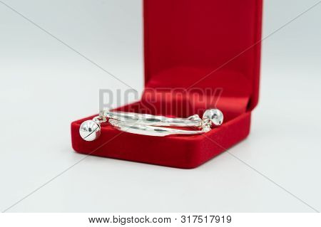 Gift Baby Is Silver Anklet In Luxury Red Box, On White Background.