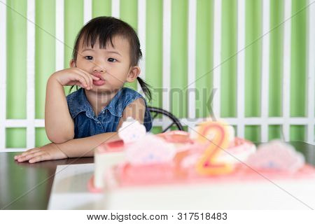 Portrait Of Asian Little Baby Girl Cheerful Birthday With The Second Years Cake, Cute Girl Enjoy In 