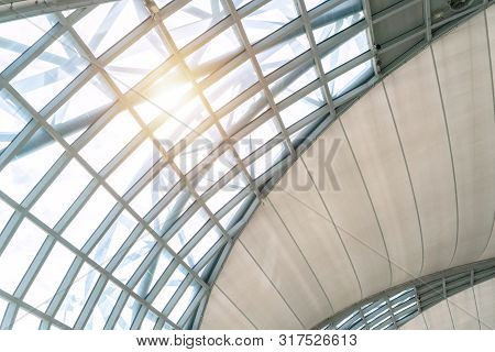 Steel Structure Of Modern Office Building Roof. Metal Windows Glass Facade Frames Supported. Abstrac