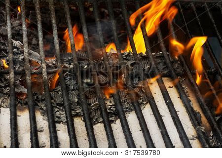 Wire Rack On Fireplace. Flame, Burning Paper And Ash Close Up Image. Concept Of The Brevity Of Life