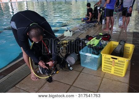 A Group Of People Doing Diving Training In A Swimming Pool In Batang / Central Java, Indonesia, Augu