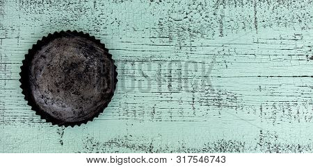 Old Vintage Baking Pan And Tins On Wooden Background. Selective Focus.
