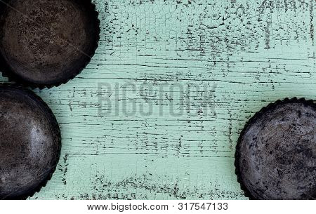 Old Vintage Baking Pan And Tins On Wooden Background. Selective Focus.