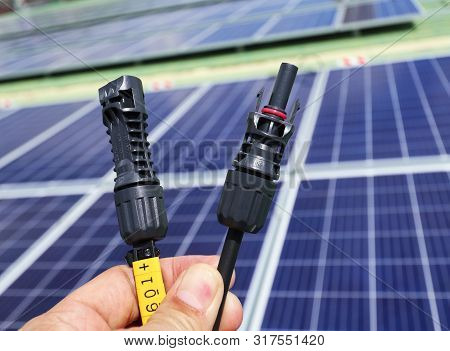 Hand Holding Solar Pv Connectors Both Male And Female Types