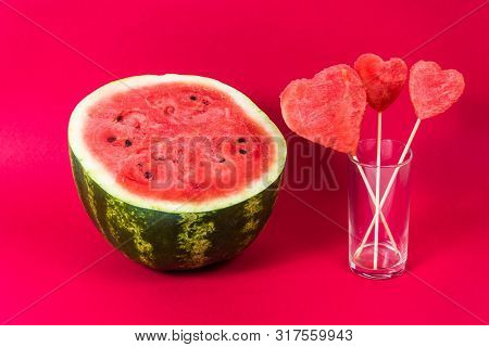 Ripe Juicy Watermelon And Fruit Pulp Decorations Decorative Hearts On Wooden Stick In Transparent Gl