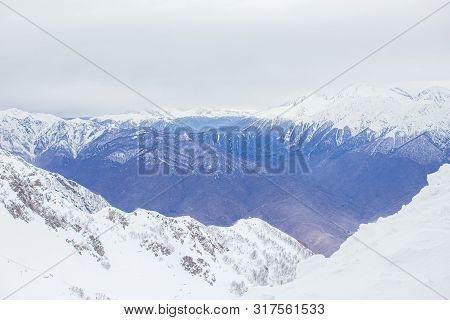 Winter Panorama View Of Mountains. Cold Winter Maille Cloudy Day In Mountains