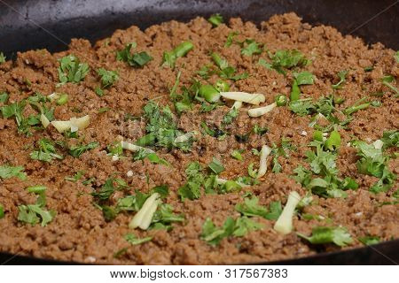 A Closeup Beef Keema (mince) Curry. Garnished With Coriander Leaves And Ginger.