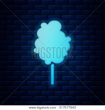 Glowing Neon Cotton Candy Icon Isolated On Brick Wall Background. Vector Illustration