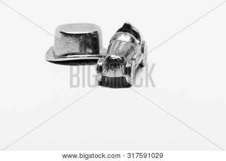 Umea, Sweden - June 30, 2019: Game Pieces From Monopoly, Car And Hat On White Background With Studio