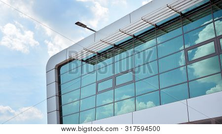 The Windows Of A Modern Building For Offices. Business Buildings Architecture.