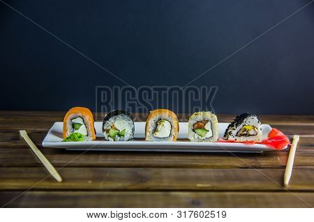 Different Rolls On A White Rectangular Plate