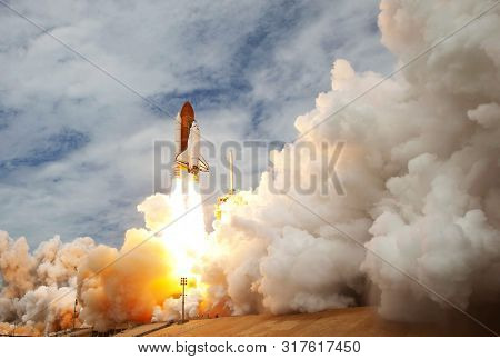 The Launch Of The Space Shuttle. With Fire And Smoke. Against The Background Of The Starry Sky. Elem