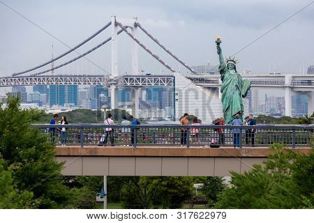 Odaiba, Japan - 18 June 2015 - Tourists Visit Odaiba To Take Picture With Statue Of Liberty And The 