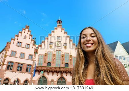 City Tourism Lifestyle In Germany. Young Woman Visiting Frankfurt Old Town. Smiling Tourist Woman In