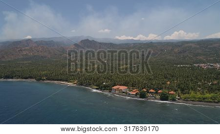 Aerial Seascape Luxury Hotel On Beach Background Mountainss In Tropical Resort. Bali, Indonesia, Tra