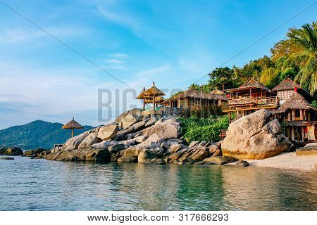 Tropical, Paradise Island With Turquoise Water Koh Tao, Thailand. Stone Beach With Bungalows