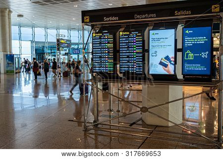 Barcelona, Spain. August 2019: Screens Showing Flight Departures In Terminal 2 Of Barcelona Internat