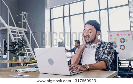 Creative Designer Slap Face When Sleepy While Working Hard With Laptop At Modern Office.workplace Li