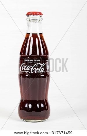 London, United Kingdom, 16th August 2019:- A Coca-cola Glass Bottle. Contains 10.6g Of Sugar Per 100