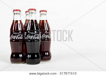 London, United Kingdom, 16th August 2019:- A Pack Of 4 Coca-cola Glass Bottles. Contains 10.6g Of Su