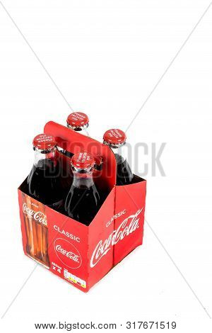 London, United Kingdom, 16th August 2019:- A Pack Of 4 Coca-cola Glass Bottles. Contains 10.6g Of Su