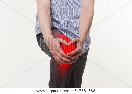 Man With Pain In Knee, Studio Shot On White Background