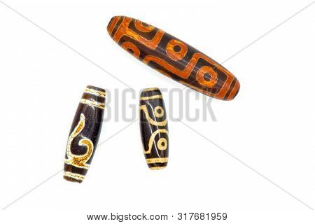 Necklace And Pendant Amulet Dzi Bead Tibet Style Isolated On White Background. Clipping Path