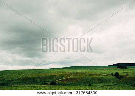 Bad Weather In Summer Day, Dark Dramatic Rainy Sky Clouds Over Agricultural Rural Landscape, Horizon