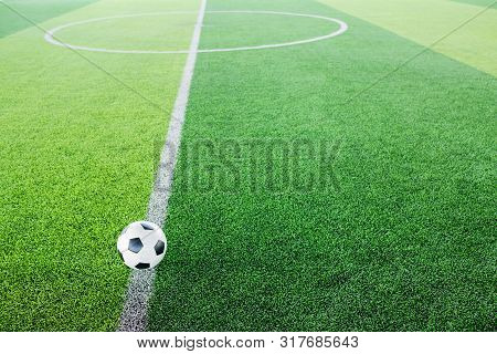 Soccer Ball On Artificial Turf For Green Background.