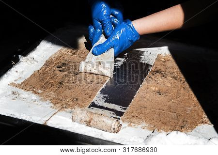 Woman In Blue Gloves Making Chocolate Fried Thai Roll Ice Cream. The Process.