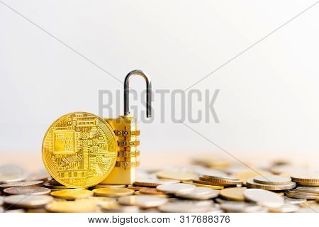Bitcoin(btc) Coin With Padlock Lying On Coins Stack. Bitcoin Security. Digital Cyber Safety Or Secur