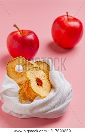 Homemade Sun-dried Organic Apple Slices, Crispy Apple Chips, On Pink Background With Fresh Apple.