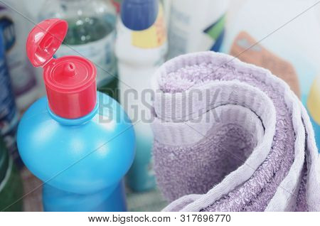 Domestic Use Cleaning Products. Multi Use Cleaning Products And A Cloth.