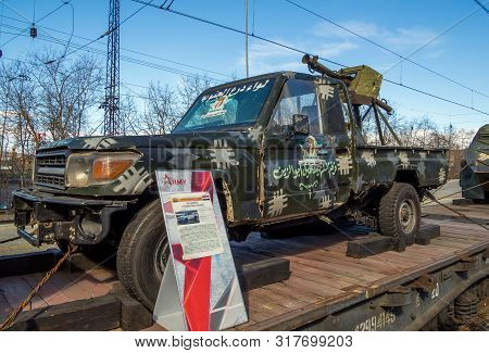 Murmansk, Russia - April 22, 2019: Pickup Truck With A Machine Gun In The Back, Traveling Exhibition