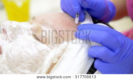 Close-up. Face Of A Woman At A Beautician Appointment. Manual Facial Cleansing. Cleansing Facial Ski