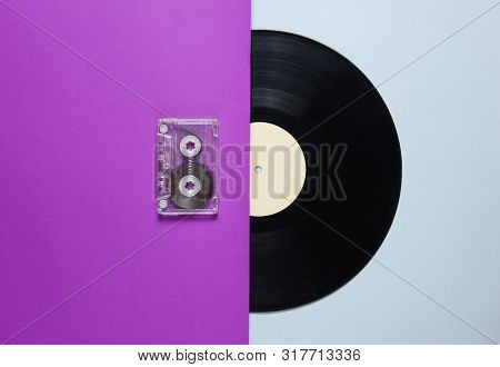 Audio Cassette, Vinyl Record On A Purple Gray Background. Retro Style. Top View