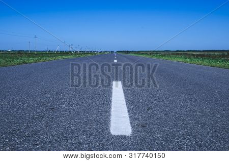 Asphalt Road Panorama In Countryside On Sunny Spring Day..