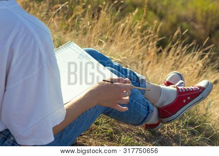 Girl Painter Holds A Brush