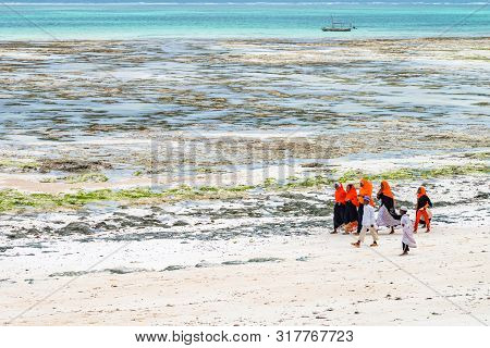 Stown Town, Tanzania - 11 January 2015: Local Children Walk On Coast In Zanzibar