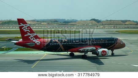 Airplane Taxiing On Runway Of Changi Airport