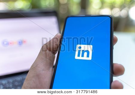 Chiang Mai, Thailand - May.26,2019: Man Holding Xiaomi Mi Mix 3 Mobile Phone With Linkedin Applicati