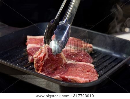 Beef Fillet On Grill, Beef Steaks Being Prepared On Grill , Cooking Meat Steaks On Kitchen