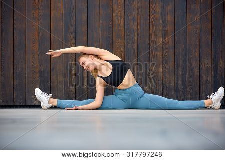Beautiful Athletic Young Girl Gymnast In Sportswear, Working Out, Element Of Gymnastics, Doing The S