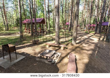 Wooden Camping Arbors  With All Conviniences In A Pine Forest